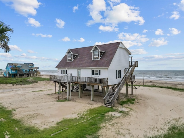 125 Driftwood Ct, Surfside Beach, TX 77541 - rear view of house with a deck with water view, a view of the beach, driveway, stairway, and a carport