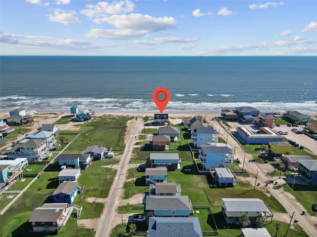 125 Driftwood Ct, Surfside Beach, TX 77541 - drone / aerial view featuring a water view, a view of the beach, and a residential view