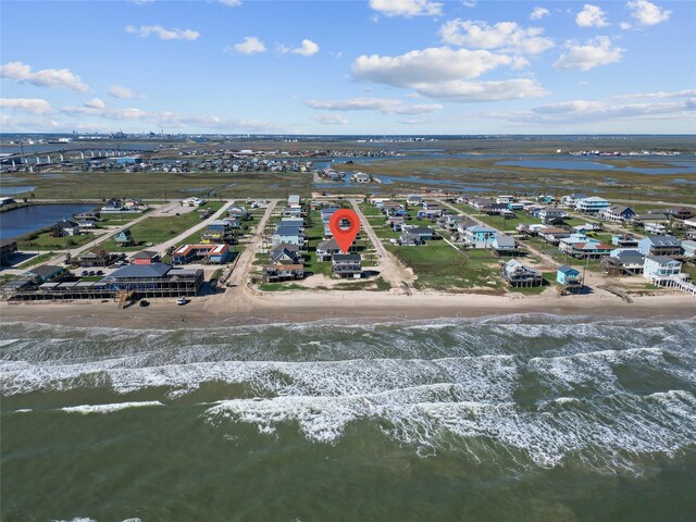 125 Driftwood Ct, Surfside Beach, TX 77541 - bird's eye view featuring a residential view, a view of the beach, and a water view