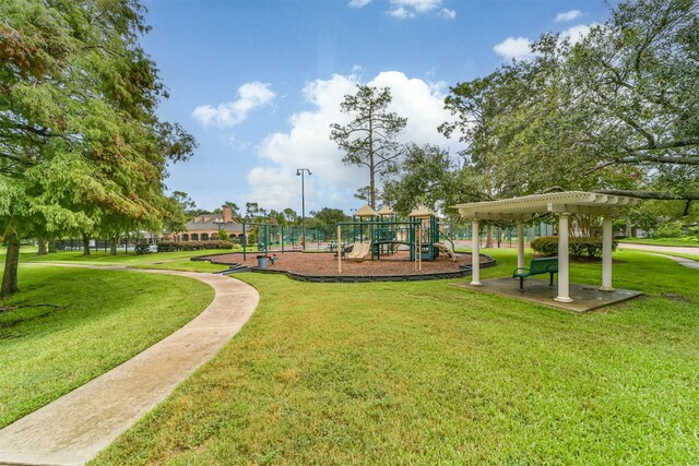 view of home's community featuring a pergola, a yard, and playground community