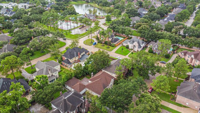 bird's eye view with a residential view and a water view