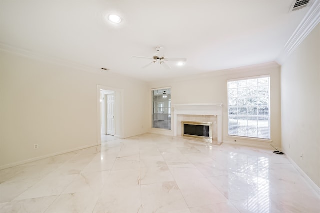 unfurnished living room featuring ceiling fan, a fireplace, and crown molding