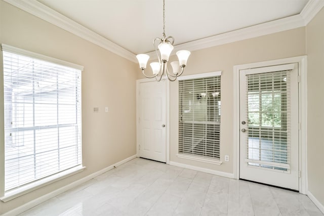 interior space with a chandelier, crown molding, and a wealth of natural light