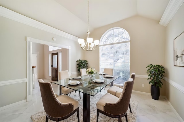 dining room with baseboards, lofted ceiling, a notable chandelier, and ornamental molding