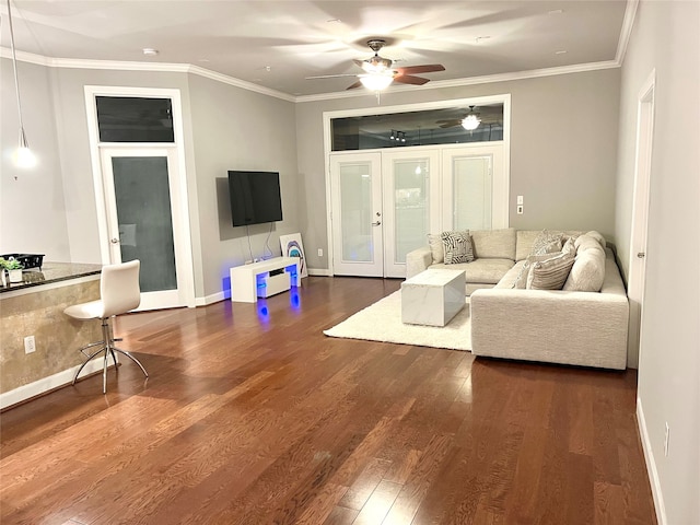 living room with ceiling fan, dark hardwood / wood-style flooring, and crown molding