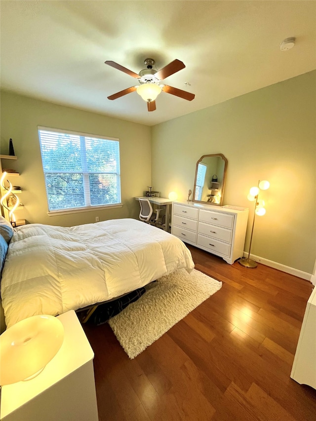 bedroom featuring hardwood / wood-style flooring and ceiling fan