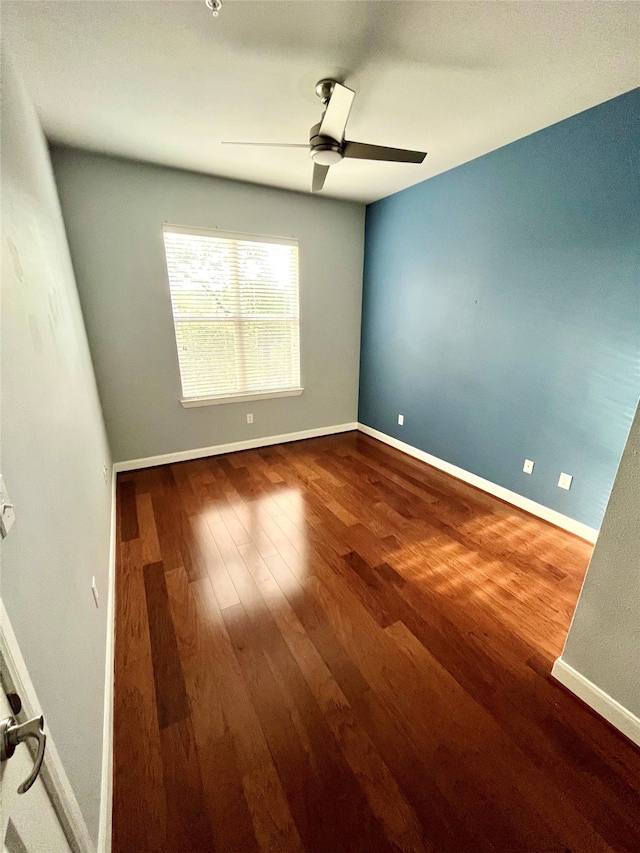 empty room featuring ceiling fan and hardwood / wood-style flooring