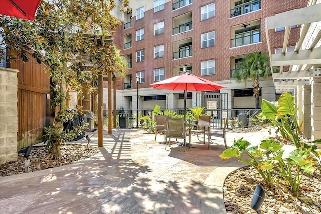 view of home's community featuring a pergola