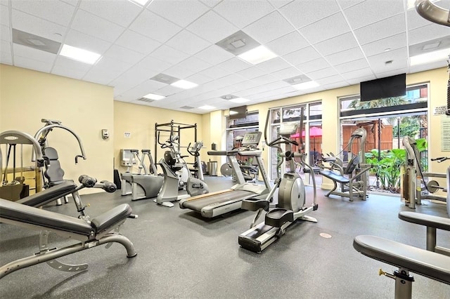 workout area with a paneled ceiling