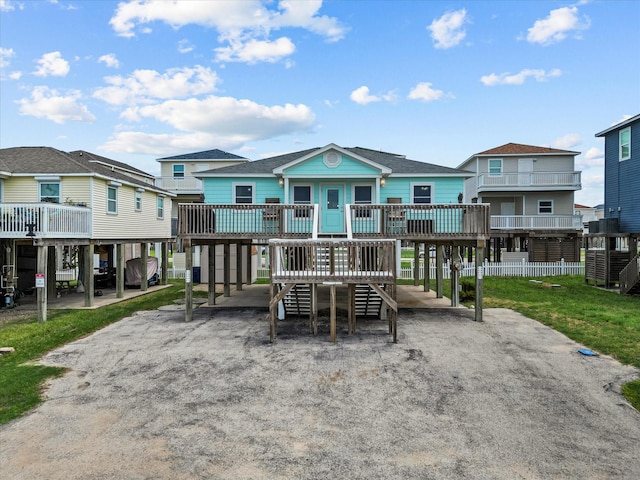 exterior space featuring a wooden deck and a residential view