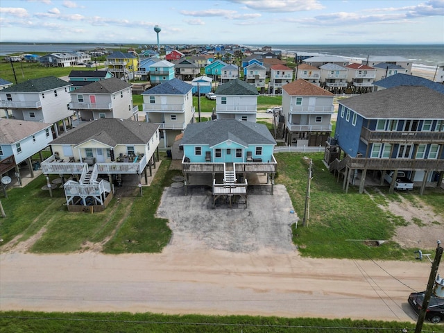 aerial view featuring a residential view and a water view