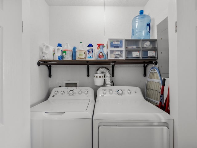 washroom featuring laundry area and washer and clothes dryer