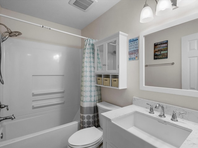 full bathroom with shower / bath combination with curtain, vanity, and toilet