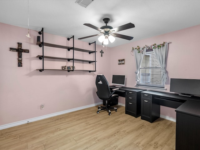 office space with light hardwood / wood-style flooring and ceiling fan