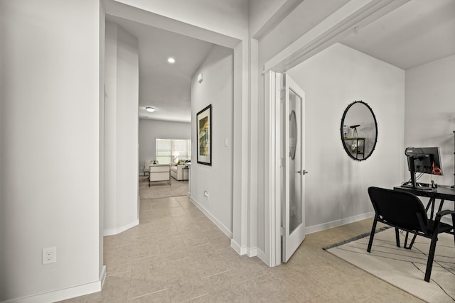 hall featuring light tile patterned floors