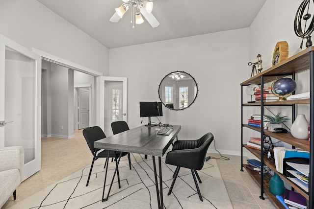 tiled home office featuring ceiling fan and french doors