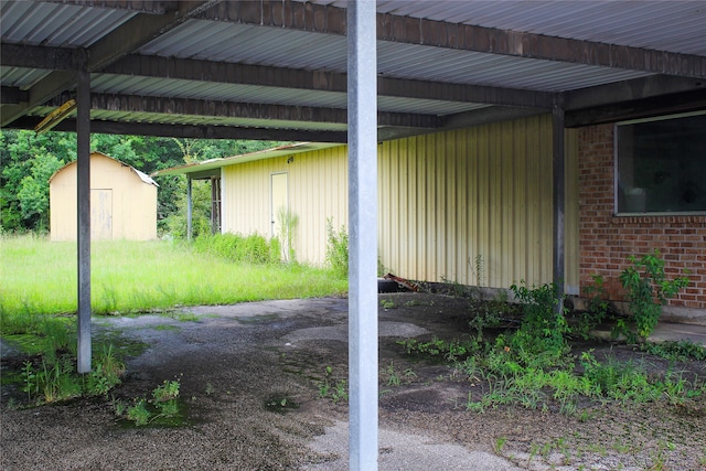 exterior details featuring carpet and beam ceiling