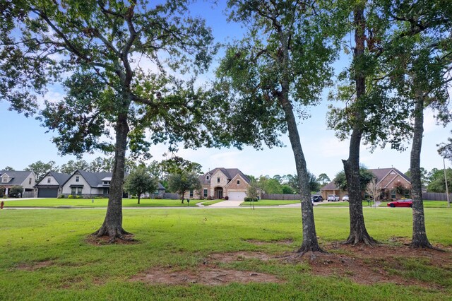 view of home's community with a lawn