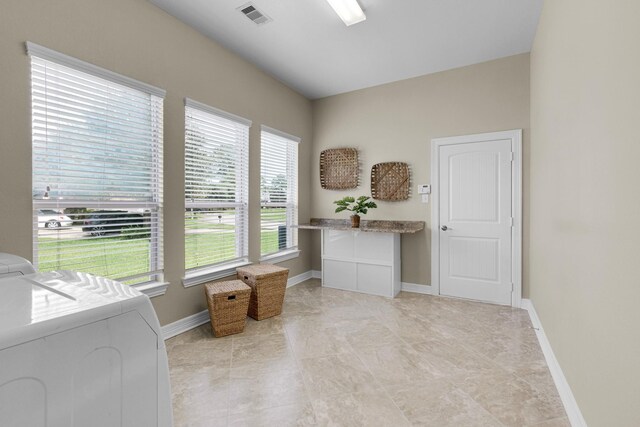 laundry area featuring cabinets and washing machine and clothes dryer