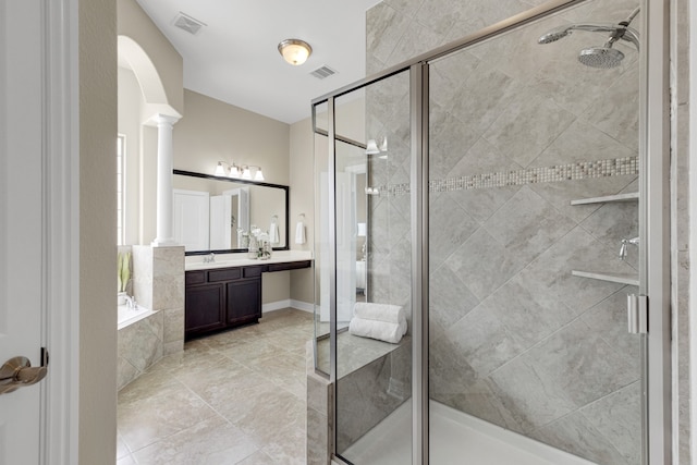 bathroom with shower with separate bathtub, vanity, tile patterned floors, and ornate columns