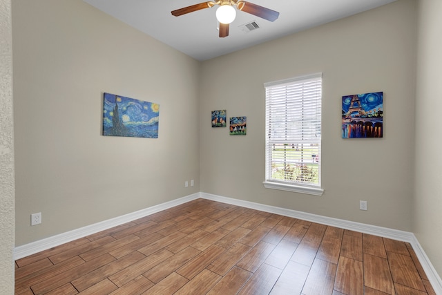 spare room featuring ceiling fan and light hardwood / wood-style floors