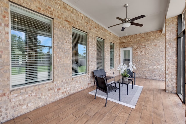 sunroom / solarium with ceiling fan