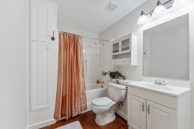 full bathroom with shower / bath combination with curtain, vanity, hardwood / wood-style flooring, and toilet