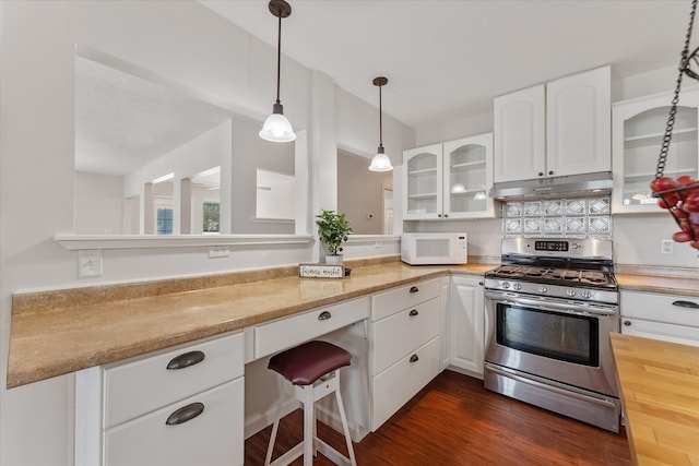 kitchen featuring gas range, white cabinetry, hanging light fixtures, and dark hardwood / wood-style floors