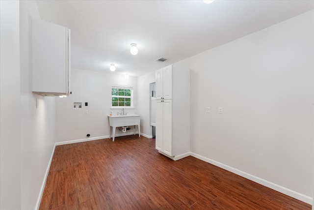 washroom featuring washer hookup, hookup for an electric dryer, and dark hardwood / wood-style flooring