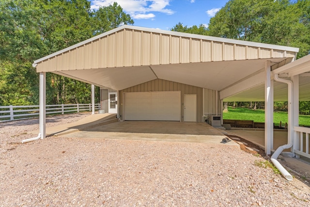 view of parking / parking lot featuring a carport and a garage