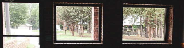 doorway to outside featuring a healthy amount of sunlight