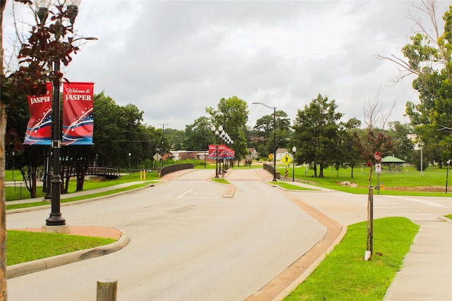 view of property's community with a yard