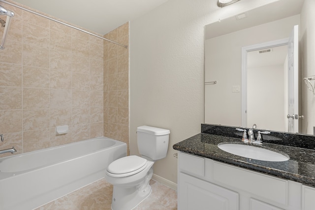 full bathroom featuring vanity, toilet, tile patterned floors, and tiled shower / bath