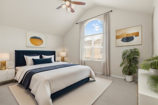 bedroom with vaulted ceiling, light colored carpet, and ceiling fan