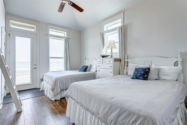 bedroom with ceiling fan, vaulted ceiling, and hardwood / wood-style floors