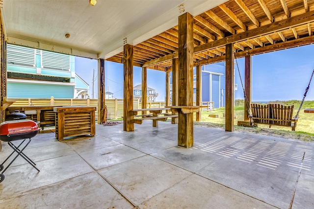 view of patio with fence and area for grilling