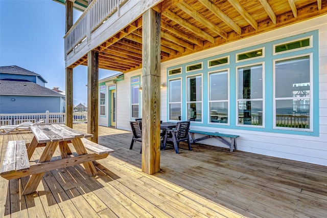 wooden deck featuring outdoor dining area