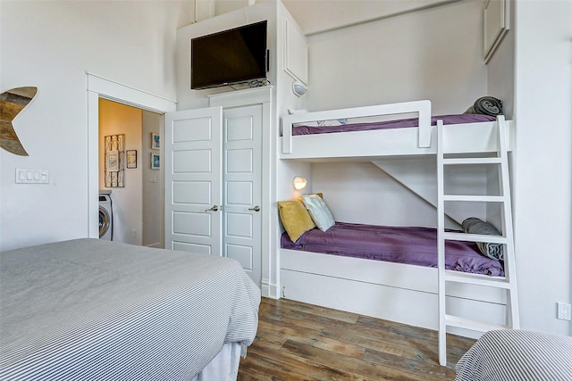 bedroom featuring washer / clothes dryer and wood finished floors