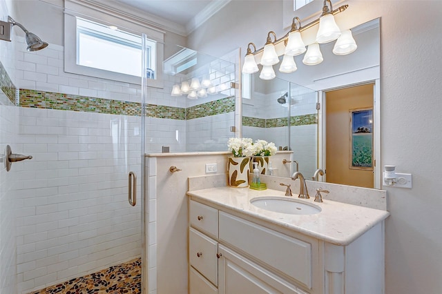 full bath with ornamental molding, a stall shower, and vanity