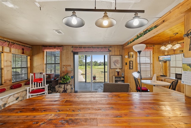 dining area with wood walls