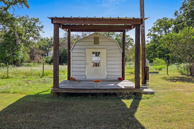 view of outbuilding with a yard