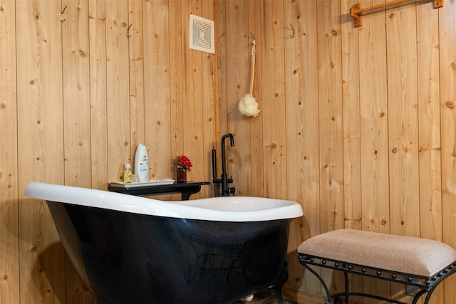 bathroom with wood walls