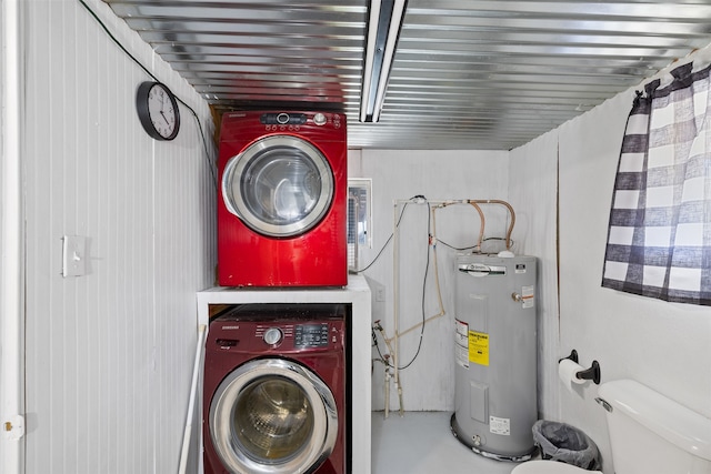 laundry area with stacked washer / drying machine and water heater