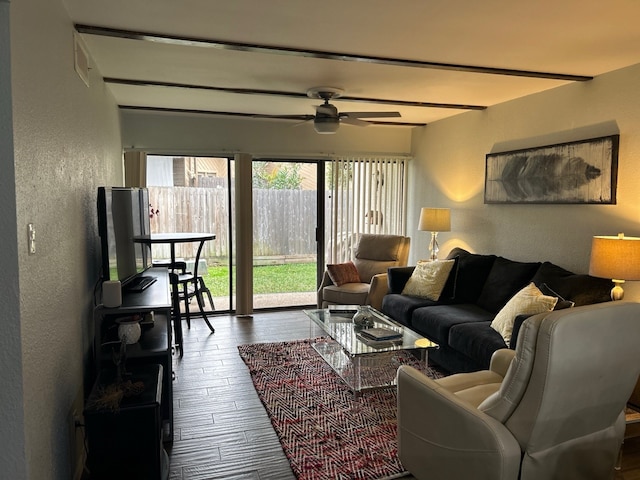 living room featuring ceiling fan and hardwood / wood-style floors