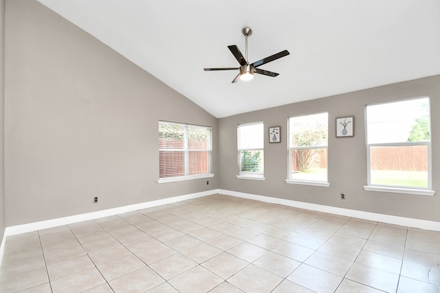 tiled spare room featuring high vaulted ceiling and ceiling fan