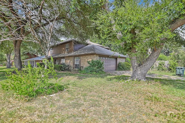 view of home's exterior featuring a garage and a yard