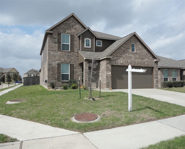 craftsman-style home featuring a garage and a front lawn