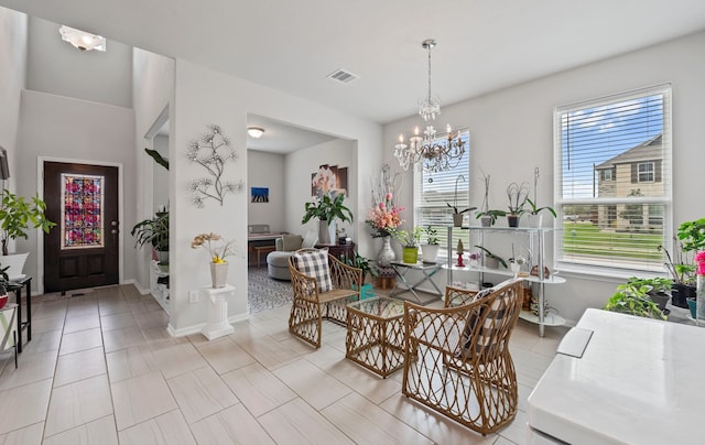 dining area featuring a notable chandelier