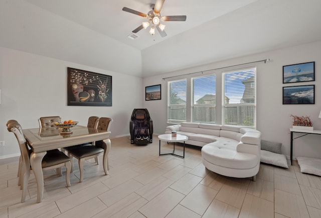 interior space featuring lofted ceiling and ceiling fan