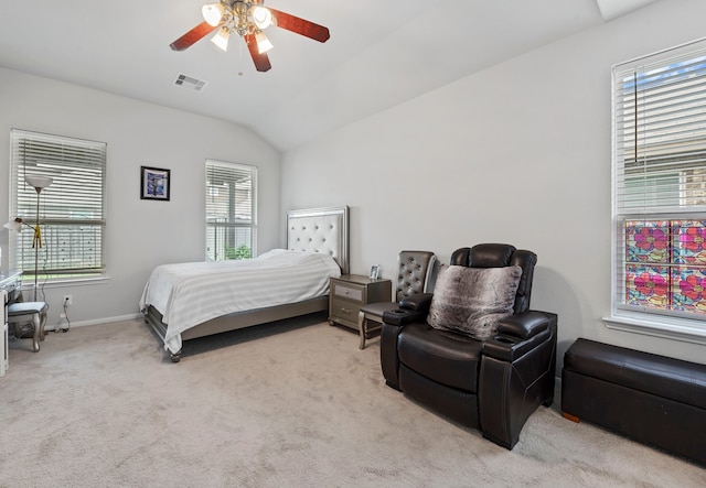 bedroom featuring ceiling fan, light carpet, and vaulted ceiling